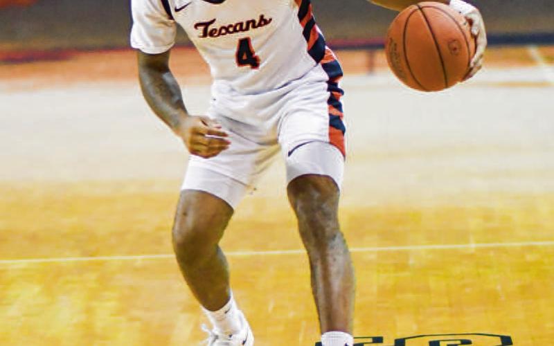 RICHARD RUNS POINT - South Plains College Texans point guard Keith Richard runs point as his team sets up a play during a game earlier this month in the Texan Dome. (Staff photo by Jentezen Smith) (
