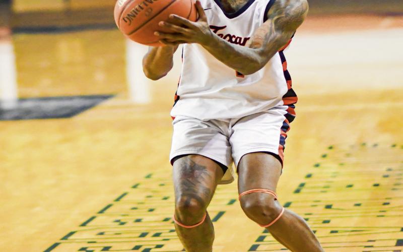 SPOT UP SHOOTER - South Plains College Texans guard Micah Bell spots up and shoots a three-pointer during a game earlier this month in the Texan Dome. Bell averages 10.8 PPG, 3.7 RPG and 1.7 APG. (Staff photo by Jentezen Smith)