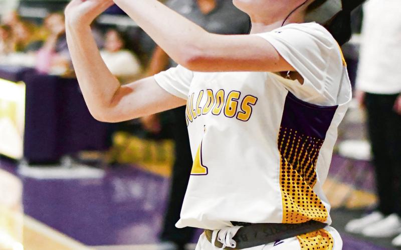 PEEK FOR THREE - Anton Lady Dawg Liberty Peek shoots a three-pointer during their against Wellman Union this past Friday night at Anton High School. (Staff photo by Jentezen Smith)