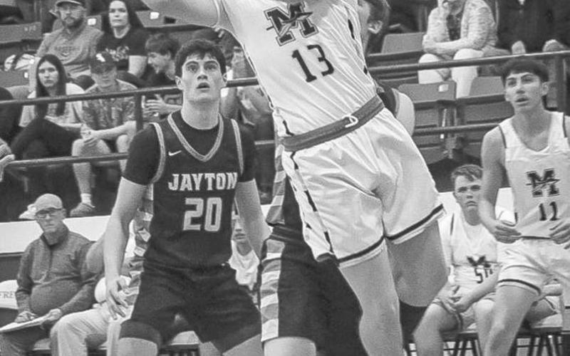 TOUGH FINISH - Morton Indian Lane Lyon made the athletic finish at the basket for the well earned two points during the team’s last playoff game against the Jayton Jaybirds this past Tuesday at Frenship High School. (Staff photo by Aalijah Soliz)