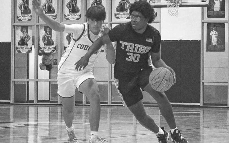 BLOW BY - Morton Indian Tra Holland blew past his defender to get past halfcourt during the team’s game against the Klondike Cougars. (Staff photo by Aalijah Soliz)