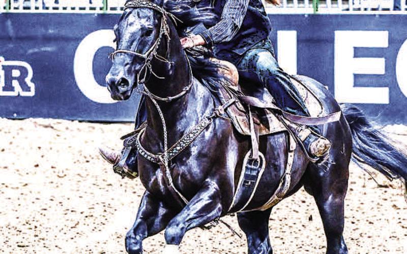 ON TO THE SECOND BARREL- SPC Sierra Telford guides her horse through the barrel racing pattern in the second preliminary round of competition. (Photo from SPC Facebook page)