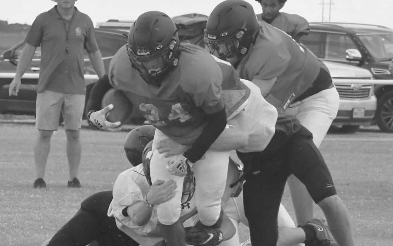 POWER- Whitharral Panther Nomar Gomez powered through a host of Lubbock Home School tacklers in the first scrimmage of the season last Friday in Whitharral. The Panthers will scrimmage in Petersburg next Friday at 5 p.m. (Photo Courtesy of Jay Kelley)