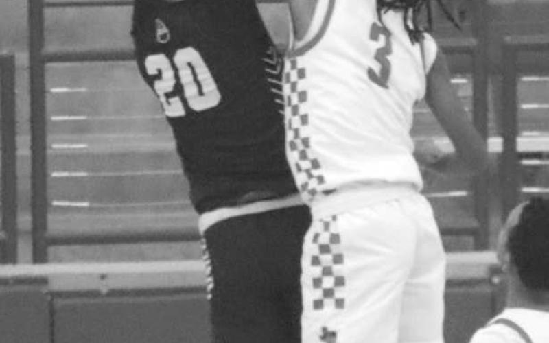 NOT IN HERE - Levelland Lobo Eryk Jones blocked the Bushland player during the teams contest in the Littlefield tournament last week. (Staff photo by Aalijah Soliz)