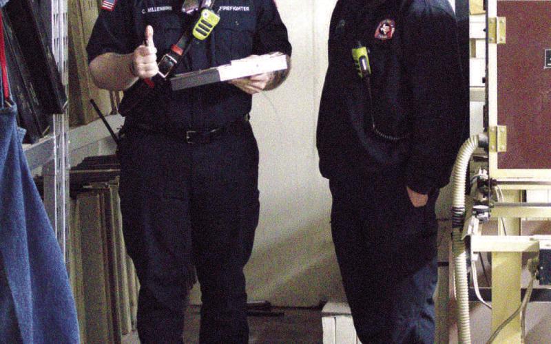 BUILDING SAFETY-- Pictured left to right conducting a fire inspection on a local business are Cade Millenbine, fire inspector and Lt. Jeff Pharis of the Levelland Fire Department. The inspections are being done to ensure all local businesses are up to code. (Staff photo by Eric Venkatesan)