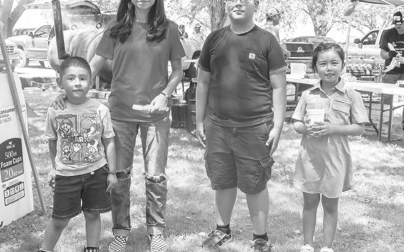 SNOW CONE LINE- The St. Anna’s Catholic Church in Morton held a Jamaica on Sunday . Pictured is Eden Rios, Jhade Rivera, Jared Rios and Hannah Rivera who attended the Jamaica They were patiently waiting in line to get a shaved ice and cool down . ( Photo courtesy of Emily Campos)