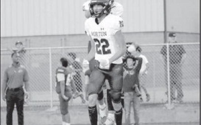 HYPED UP - Morton athletes were excited for making the fourth down stop on the Crosbyton Chiefs big drive towards the end of the first half. The Morton Indians will play this Friday against Mundayas the home team at 7 p.m. (Staff photo by Aalijah Soliz)