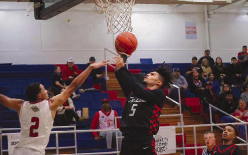 TOUGH SHOT - Levelland Lobo Sean Landrum layed the ball up during the teams season opener against the Plainview Bulldogs as the away team. The Lobos played against the Dimmitt Bobcats this Tuesday at home for their second game of the season. (Staff photo by Aalijah Soliz)