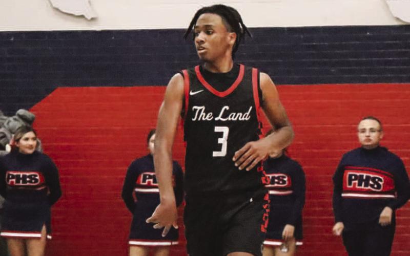 BRING IT UP - Levelland athlete Eryk Jones brought the ball up the court to run the offense during the teams seaason opener this past Friday night. (Staff photo by Aalijah Soliz)