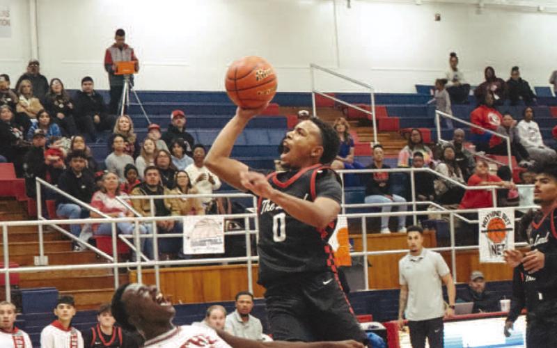 TOUGH DRIVE - Levelland Lobo Jayden Castillo made the great shot over the Plainview Bulldog last Friday during the teams season opener. (Staff photo by Aalijah Soliz)