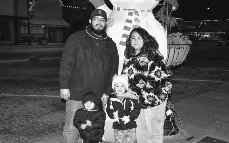 BRIGHT NIGHT – From left, Anthony, Antonio, Sofia and Martha were lit up with glowstick jewelry that they wore to the Christmas on the Square event in downtown Levelland on Dec. 5. (Staff photo by Evin Thomas)