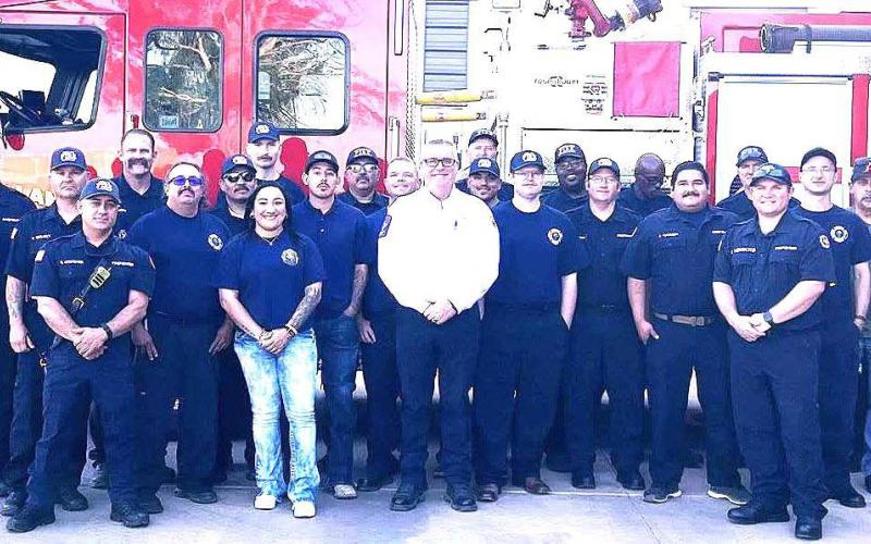 1 LFD BRUSH TRUCK GROUP- The Levelland Fire Department held it Brush Truck Roll-in on Tuesday, with the firefighting team pushing B-15 in the fire station bay. Chief Brian Horton later presented awards to several firefighters for their dedication to the department and community for a job well done . (Levelland Fire Department photo)