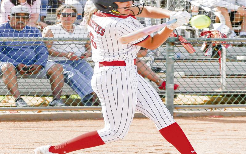 HIGH-BALL HITTER - Levelland Loboette Jill Lopez makes contact with a pitch high in the strike zone during their district softball game against Liberty this past Tuesday at Levelland High School. (Staff photo by Jentezen Smith)