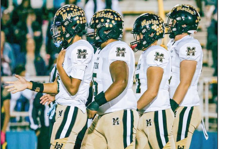 REPPIN’ FOR MORTON - The Morton Indians football players walk together during their game on the road against Hale Center this past Friday. The Indians would fall to Hale Center 55-3. They’ll compete in the first round of the playoffs next week. (Photo provided by Gillian Ruiz)