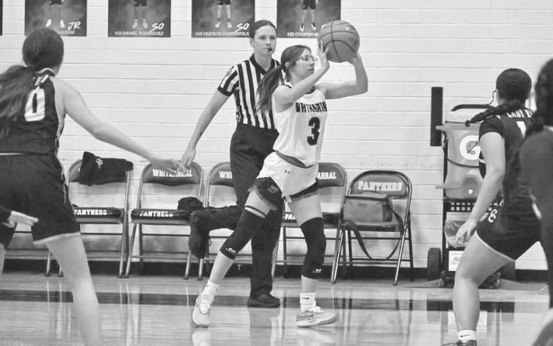 OUTLET PASS - Whitharral Lady Panther Elizabeth Reyna passed the ball down the court to her teammate during the team’s first district game in their win. (Photo courtesy of Whitharral ISD)