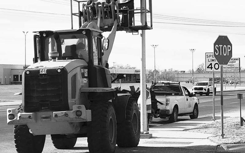 DECORATION REMOVAL- A crew from the City of Levelland Streets Department spent time Thursday morning removing the Christmas decorations that are placed on the light poles along the main city streets. (Staff photo by Dom Puente)