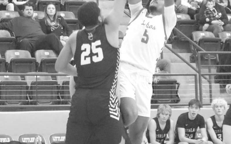 FADEAWAY - Levelland Lobo Sean Landrum shot the ball fading away from the basket to create some separation against the Bushland defense during the Littlefield Tournament. (Staff photo by Aalijah Soliz)