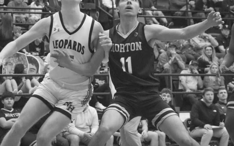 BOX OUT - Morton Indian A.J. Mendoza boxed out the New Home defender during the team’s last game of the season at Levelland High School. (Staff photo by Aalijah Soliz)
