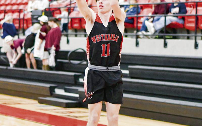 DOCKERY FROM DEEP - Whitharral Panther Ayden Dockery shoots a three-pointer during their playoff basketball game against the Klondike Cougars this past Monday night at Brownfield High School. (Staff photo by Jentezen Smith)