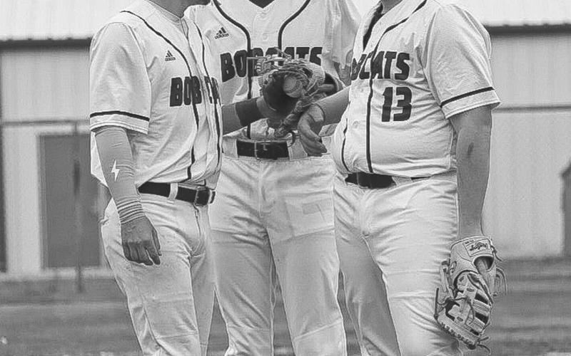 GROUP UP - Smyer Bobcats Kaden Price, Caleb Pearce and Colton Burriss got together on the mound during the team’s game against the Post Antelopes on March 29. (Staff photo by Aalijah Soliz)