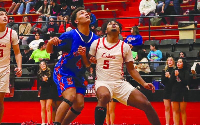 BOX OUT - Levelland Lobo Sean Landrum boxed out his defender during their game against Sundown at home before their district opener this past Friday. (Staff photo by Aalijah Soliz)