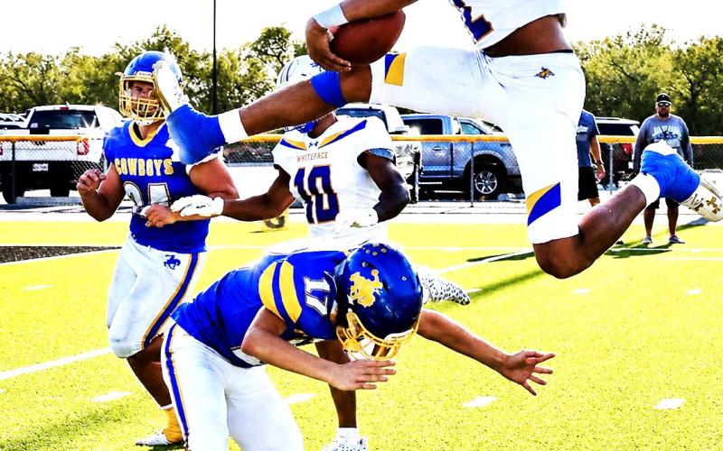 First Games of Season - Football action officially got underway for teams in Hockley and Cochran County for seven high school varsity teams. Three teams kicked off their season with big wins including Levelland, Whiteface and Anton. Shown is Whiteface Antelope Isaak Soliz clearing the defense. (Photo by Holly Crutcher)