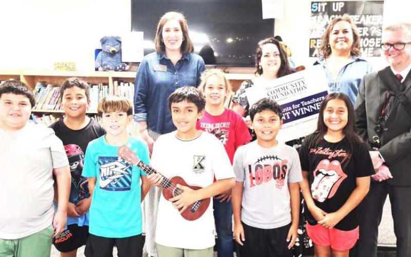 COMMUNITY FOUNDATION OF WEST TEXAS GRANT - Capitol | Meredith Martinez — Ukuleles. Martinez will use her grant to purchase ukuleles, putting instruments directly into students' hands and giving them the opportunity to learn music through creativity, rhythm and performance. Shown are representatives, music teacher Meredith Martinez, principal James Daniel, and Uriel Adame, Jonathan Vargas, Eden De La Rosa, Martin Acevedo, Rene Helsley, Leon Muniz and Kourtney Castellano. Harkins photo