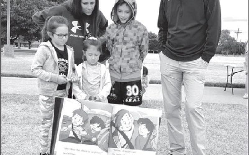 READING NIGHT- Capitol Elementary hosted their Parent Reading Night they were able to read three awesome books on an out door book walk. There was a great turn out and it was good idea. In photo in no particular order Brieana, Trevor, Ian, Gracelyn and Emmalyn Tucek (photo submitted by Cristal Isaacks)