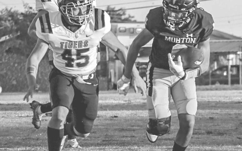 FOOT RACE - Morton Indian E.J. Rivas outran the Slaton Tiger defender this past Friday at home for the team’s homecoming. (Staff photo by Aalijah Soliz)