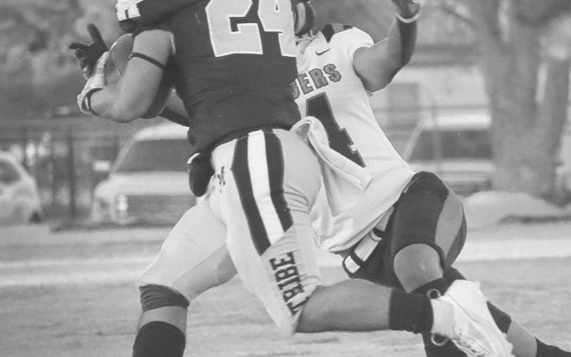 TOO STRONG - Morton Indian Christian Enriquez stiff armed the Tiger defender this past Friday during the team’s homecoming game. (Staff photo by Aalijah Soliz)