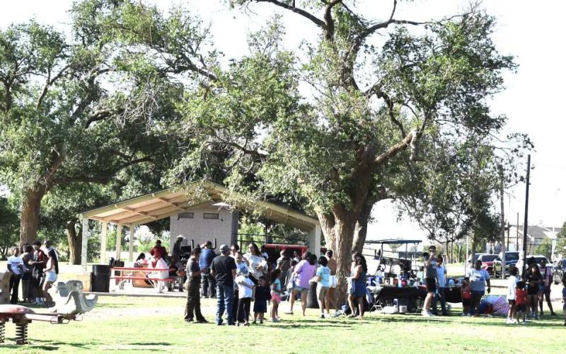 COMMUNITY INVOLVEMENT - Residents lined up for the annual community meal this past weekend at the 37th Juneteenth celebration. (Staff photo)