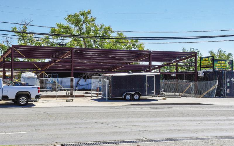 - Construction of Head Hunters Smoke Shop is moving along as the steel framing of the building has been placed. The business will be replacing the torn down Nothin’ Butt Smokes building located at 203 College Avenue. (Staff photo by Evin Thomas)