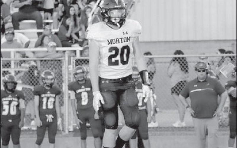 REGROUP - Morton athlete Cade Lyon went to the huddle after making the tackle on a Crosbyton Chief in their win last Friday as the away team. (Staff photo by Aalijah Soliz)