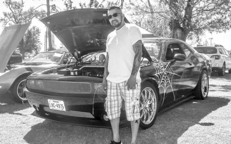 2014 DODGE CHALLANGER- Pictured is Junior Ramirez with his 2014 Dodge Challanger who was one of the many participants who entered the Thunder on the Plains Car Show on Saturday at the Levelland City Park. ( Photo courtesy of Emily Campos)