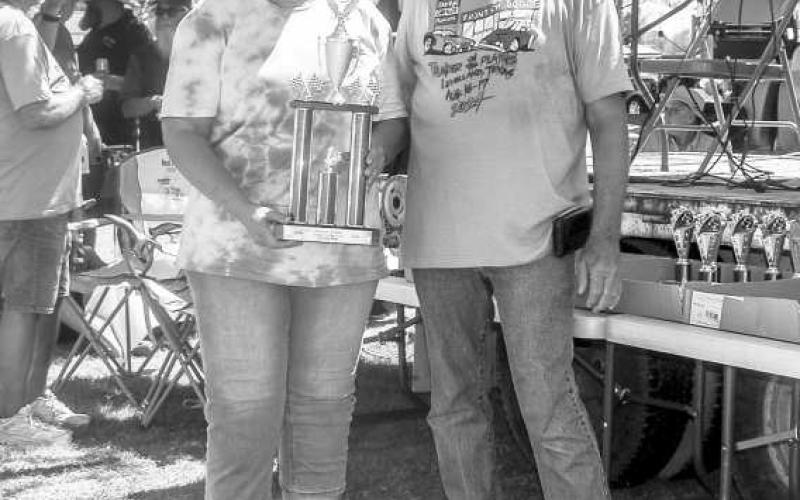 PEOPLES CHOICE - Pictured is Dawn Chancy who won the Peoples Choice Award which was presented by R.H. Reaves at the Thunder on the Plains Car Show on Saturday at the Levelland City Park with her 1966 Ford Bronco. (Photo courtesy of Emily Campos)