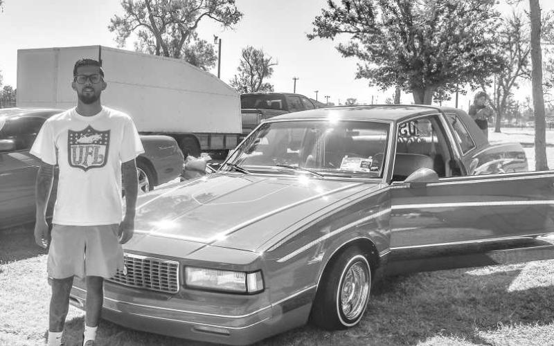CHEVY MONTECARLO - The Thunder on the Plains had their 18th Annual Car Show on Saturday at the Levelland City Park. Pictured is Saul Davalos with his custom modified 1987 Chevy Montecarlo who was one of the many who participated in the car show. (Photo courtesy of Emily Campos)
