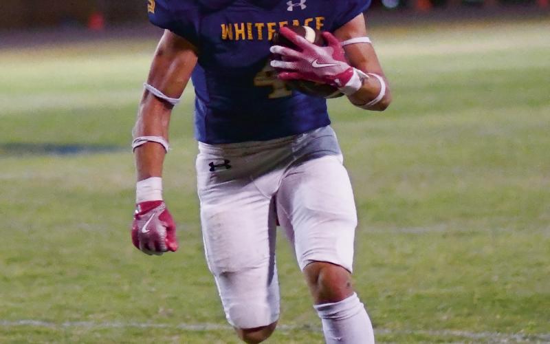 FULL SPEED AHEAD - Junior Jaxon Hodge rushes the football with a head of steam for Whiteface during their Homecoming game against Springlake-Earth this past Friday. Hodge would rush for 203 yards and score five total touchdowns in the Antelopes 82-48 win. (Staff photo by Jentezen Smith)