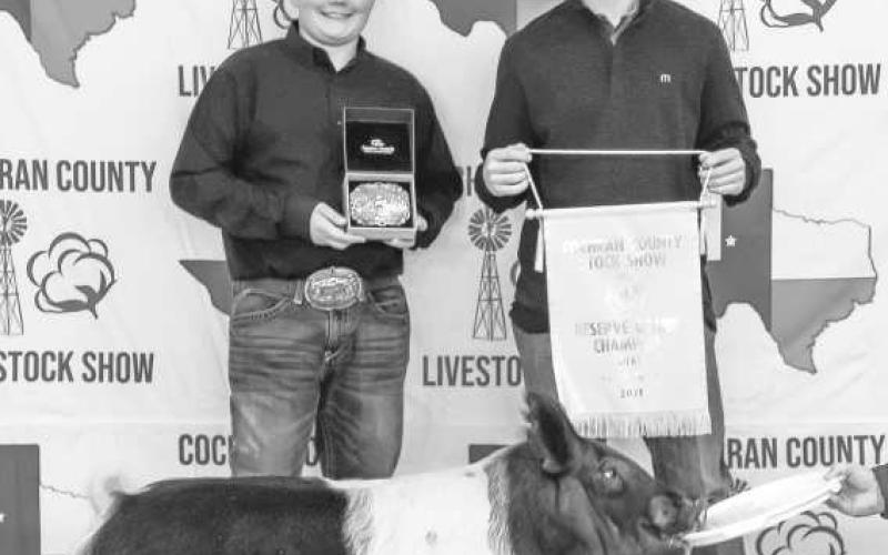 SHOWING SWINE- Mason Albus and Luke Gresham participated in the 2025 Cochran County Livestock Show in Morton on Saturady. The show was held at the County Show Barn. (Staff Photo by Essence Childers)