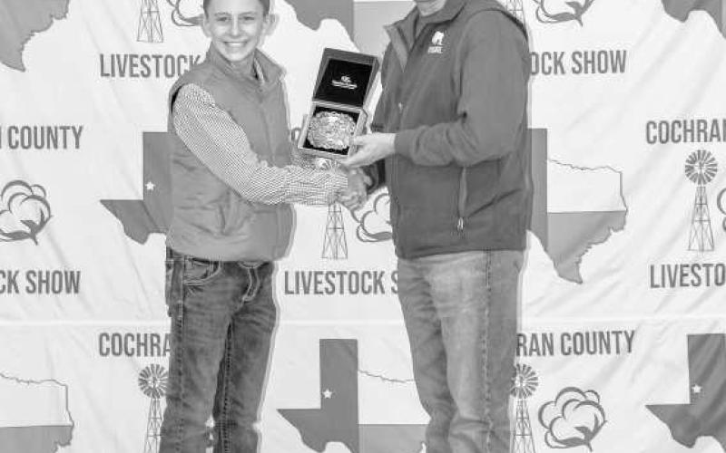 JUNIOR GOAT SHOWMAN- Parks Tucker was presented a awarded a buckle donated and pesented by Eliseo Rocha at the Cochran County Livestock Show. (Staff Photo By Essence Childers)