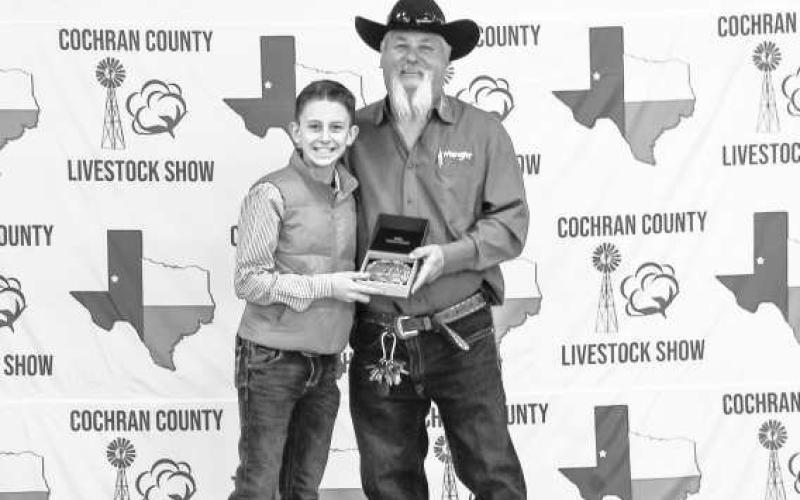 GRAND CHAMPION GOAT- Parks Tucker was presented a buckle donated and presented by Billy and Sandy Roberts at the Cochran County Livestock Show held last Saturday at the County Show Barn in Morton. (Staff Photo by Essence Childers)