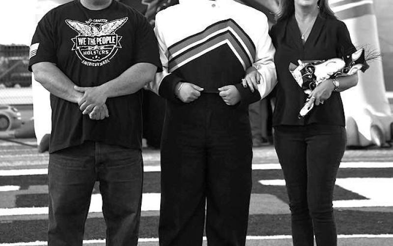 SENIOR BAND - Levelland seniors were recognized last Friday during the Lobo football home game against the Borger Bulldogs. Senior Joshua Torres was escorted by his parents Jack and Staci Torres. (Staff Photo by Dom Puente)