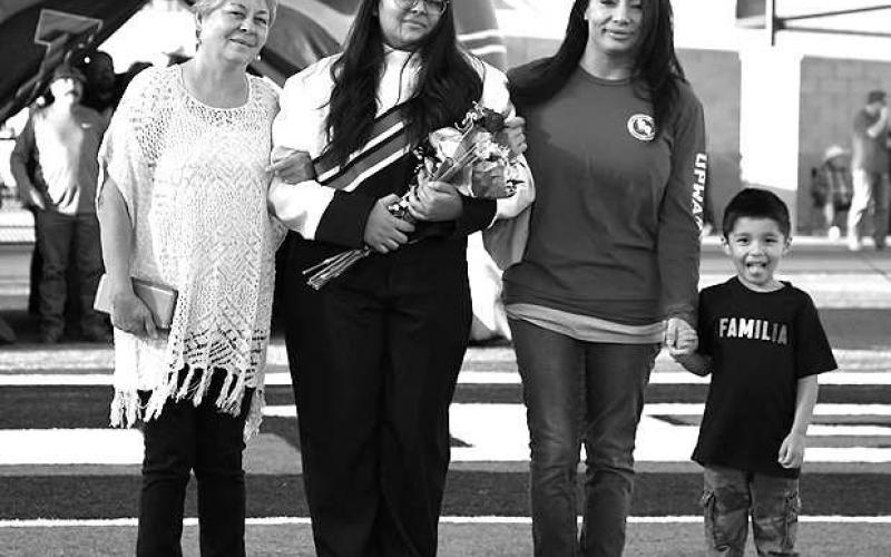 SENIOR BAND - Levelland seniors were recognized last Friday during the Lobo football home game against the Borger Bulldogs. Senior Isabelle Romero was escorted by her grandmother Reyes Guillen, aunt Aubrianna Guillen and nephew. (Staff Photo by Dom Puente)