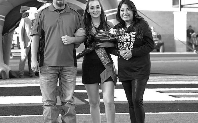 SENIOR CHEER – Levelland seniors were recognized last Friday during the Lobo football home game against the Borger Bulldogs. Senior Addysyn Hill was escorted by her parents Jeremiah and Alexis Gavin. (Staff Photo by Dom Puente)