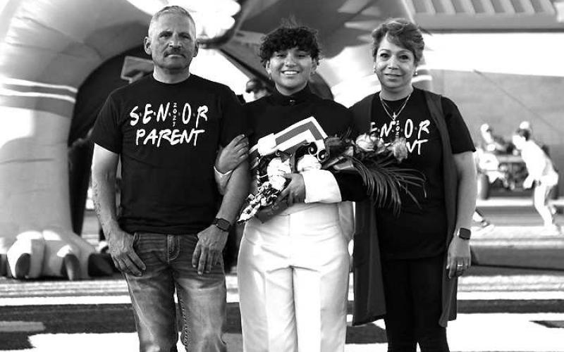 SENIOR BAND - Levelland seniors were recognized last Friday during the Lobo football home game against the Borger Bulldogs. Senior Sarahi Munoz was escorted by her parents Roberto and Grisenda Munoz. (Staff Photo by Dom Puente)