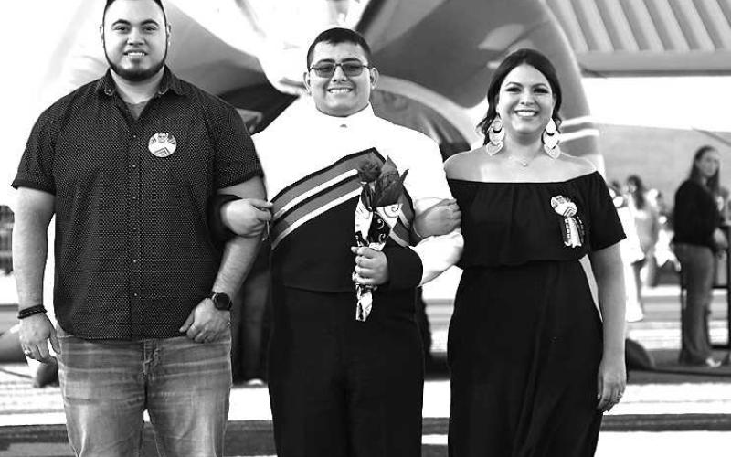 SENIOR BAND - Levelland seniors were recognized last Friday during the Lobo football home game against the Borger Bulldogs. Senior Gabriel Garza was escorted by his parents Aaron and Angie Garza. (Staff Photo by Dom Puente)