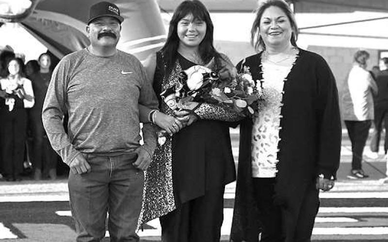 SENIOR BAND - Levelland seniors were recognized last Friday during the Lobo football home game against the Borger Bulldogs. Senior Anadelia Sanchez was escorted by her parents David and Ana Sanchez. (Staff Photo by Dom Puente)