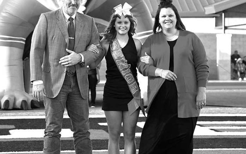 SENIOR CHEER – Levelland seniors were recognized last Friday during the Lobo football home game against the Borger Bulldogs. Senior Cooper Wallace Scifres was escorted by her parents Ray and Ashley Scifres. (Staff Photo by Dom Puente)