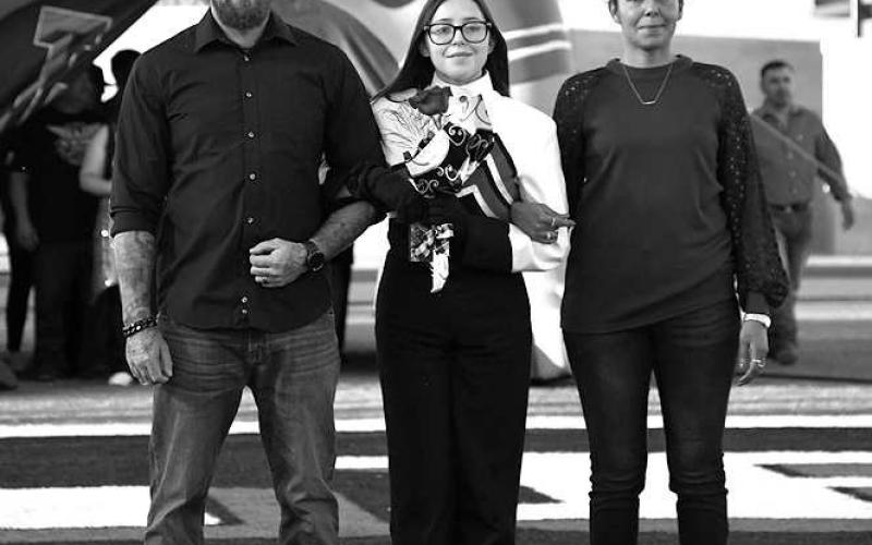 SENIOR BAND - Levelland seniors were recognized last Friday during the Lobo football home game against the Borger Bulldogs. Senior Trisha Sharpe was escorted by her parents Denis Pitre and Claudia Maldonado. (Staff Photo by Dom Puente)