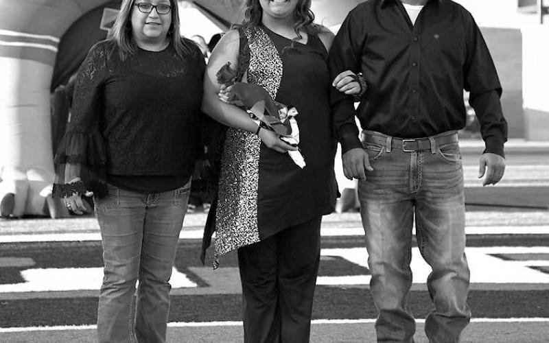 SENIOR BAND - Levelland seniors were recognized last Friday during the Lobo football home game against the Borger Bulldogs. Senior Breanna Martinez was escorted by her parents Jessica and Scott Martinez. (Staff Photo by Dom Puente)