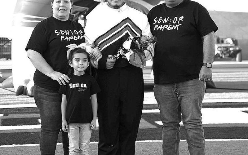 SENIOR BAND - Levelland seniors were recognized last Friday during the Lobo football home game against the Borger Bulldogs. Senior Heric Huerta Moncada was escorted by his parents Elise Veronica Moncada and Heric Huerta along with his younger sister. (Staff Photo by Dom Puente)